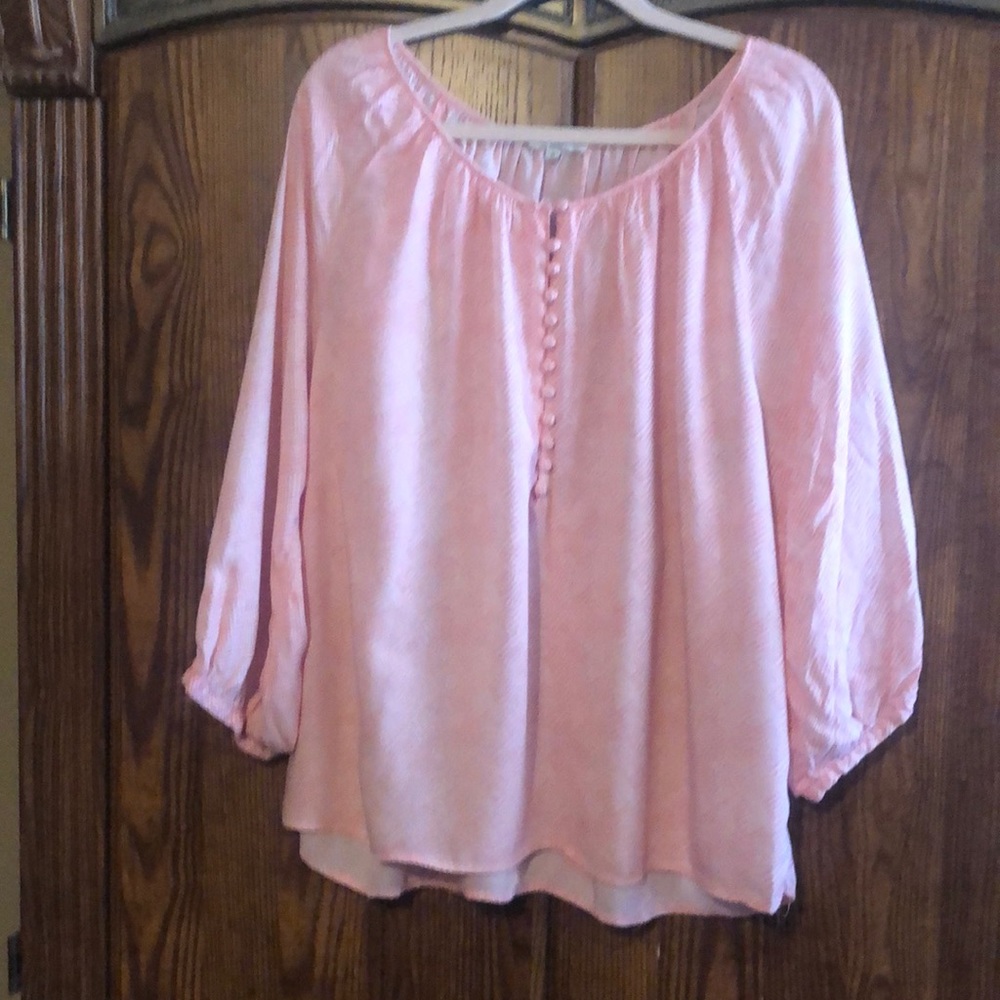 Peach and white pull over top.